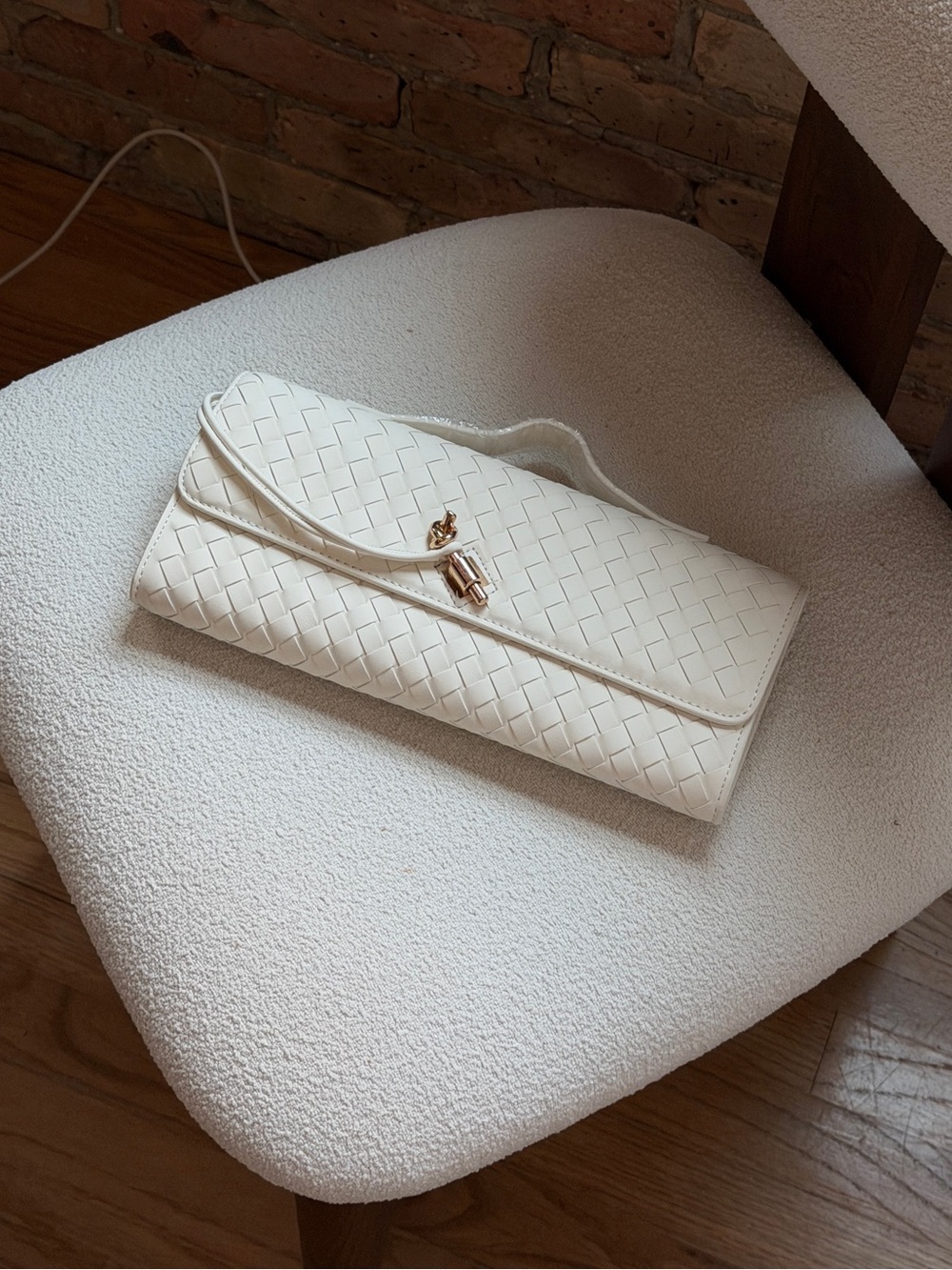 Elegant White Woven Leather Clutch with Gold Accent